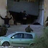 Two Palestinian terror suspects are seen apparently surrendering to Israeli forces in the West Bank city of Jenin, before they were shot dead, November 27, 2025. (Screenshot: X; used in accordance with Clause 27a of the Copyright Law)