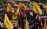 Iranian demonstrators hold Iranian, Palestinian and Lebanon's Hezbollah flags in an anti-Israeli rally after their Friday prayer in Tehran, Iran, Friday, April 11, 2025. (AP Photo/Vahid Salemi)