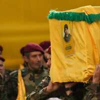 Hezbollah members carry the coffin of the terror group's military chief of staff, Haytham Tabatabai, during his funeral procession in a southern suburb of Beirut, Lebanon, November 24, 2025. (AP Photo/Hussein Malla)