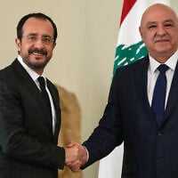 Lebanese President Joseph Aoun, right, shakes hands with his Cypriot counterpart Nikos Chistodoulides after a joint press conference, at the presidential palace in Baabda east of Beirut, Lebanon, November 26, 2025. (AP Photo/Hussein Malla)