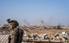 IDF troops are seen as airstrikes are carried out in southern Gaza's Rafah, November 23, 2025. (Emanuel Fabian/Times of Israel)