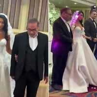 Leaked footage from mid-2024 shows Fatemeh Shamkhani in a Western-style, low-cut strapless wedding dress, left, being led down the aisle by her father Ali Shamkhani, a close adviser to Iran's Supreme Leader Ayatollah Ali Khamenei. (Screen capture: Iran International, used in accordance with Clause 27a of the Copyright Law)