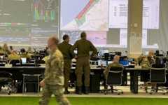 Officers and civilians from the US, Israel and around 20 other countries work at the Civil-Military Coordination Center in Kiryat Gat, Israel, November 19, 2025 (Lazar Berman/The Times of Israel)