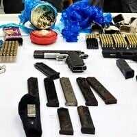 Handguns, magazines and ammunition discovered at a construction site in the northern town of Arraba on November 22, 2025. (Israel Police)