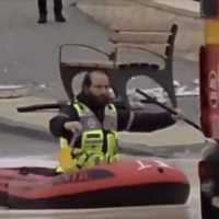 A United Hatzalah volunteer rescues stranded travelers from a flooded road in Beit Shemesh, November 25, 2025. (Screenshot/United Hatzalah)