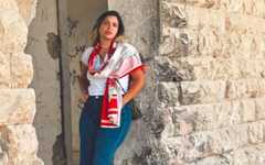 Naama Kazes, of the West Bank settlement of Leshem, poses near her home in 2025. (Courtesy)