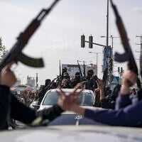 Members of the al-Qassam Brigades, the armed wing of Hamas, take part in a parade as they celebrate a ceasefire agreement between Hamas and Israel in Deir al-Balah, Gaza Strip, on January 19, 2025. (AP Photo/Abdel Kareem Hana, File) Members of the al-Qassam Brigades, the armed wing of Hamas, take part in a parade as they celebrate a ceasefire agreement between Hamas and Israel in Deir al-Balah, Gaza Strip, on January 19, 2025. (AP Photo/Abdel Kareem Hana, File)