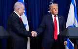 US President Donald Trump (R) shakes hands with Prime Minister Benjamin Netanyahu as Trump listens to a question from a reporter at the end of a news conference at Mar-a-Lago, on December 29, 2025, in Palm Beach, Fla. (AP Photo/Alex Brandon)