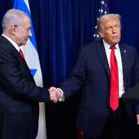 US President Donald Trump (R) shakes hands with Prime Minister Benjamin Netanyahu as Trump listens to a question from a reporter at the end of a news conference at Mar-a-Lago, on December 29, 2025, in Palm Beach, Fla. (AP Photo/Alex Brandon)