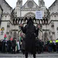 Supporters of anti-Israel group Palestine Action stage a protest outside the Royal Court of Justice in London, Britain, February 13, 2026. (AP Photo/Kin Cheung)