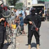 Armed Hamas police officers patrol in Gaza City, October 11, 2025. (Ali Hassan/Flash90)