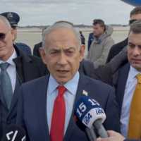 Prime Minister Benjamin Netanyahu speaks to reporters on the tarmac of Joint Base Andrews in Maryland ahead of his return to Israel, February 12, 2026. (Lazar Berman/The Times of Israel)