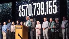 Employees and supporters of the University of Saskatchewan celebrate as the organization surpasses its fundraising goal of $500 million