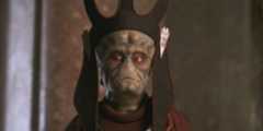 Nute Gunray wearing a headdress in Star Wars: The Phantom Menace.