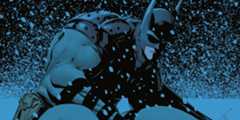 Batman crouches in the snow