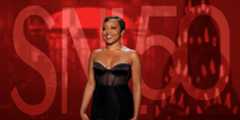Quinta Brunson in front of a red SNL background.
