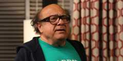 Frank in a hoodie and green shirt in It's Always Sunny in Philadelphia