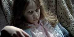 Regan gives an eerie look to someone off camera