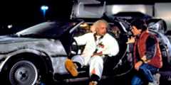 Michael J. Fox as Marty McFly with Christopher Lloyd as Doc Brown sitting in the DeLorean in Back to the Future