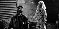 a black and white photo of Charlie and Rickety Cricket standing in an alley in It's Always Sunny