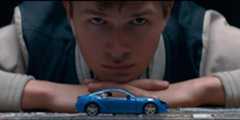 Baby (Ansel Elgort) staring at a toy car in Baby Driver