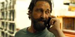 Big Nick (Gerard Butler) making a phone call in Den of Thieves 2: Pantera