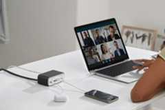 Anker 525 Charging Station on desk connected to laptop, smartphones and earbuds