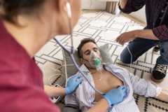 a nurse attends to a cardiac patient