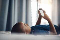 Child on smartphone in bed