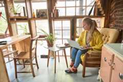 photo of a woman writing ideas on paper 