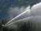 Moving spray irrigator