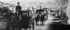 A funeral cortège moves through Hokitika, 1914