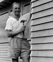 A Dutch immigrant in front of his house