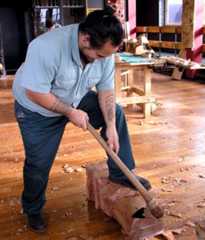 Carving with a toki pounamu (New Zealand jade or nephrite adze)