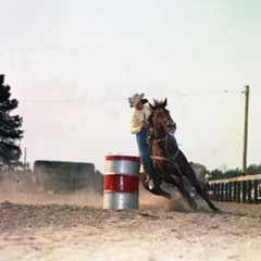 Photo of Woman barrel racing. Item from the Horse Country USA Archive.