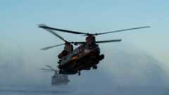 Two 160th Special Operations Aviation Regiment MH-47G Chinook helicopters hoover above Banana River, Florida, Feb. 15, 2023, during combat search and rescue training. The 160th SOAR's mission is to organize, equip, train, resource and employ Army special operations aviation forces worldwide in support of contingency missions and combatant commanders. (Staff Sgt. Darius Sostre-Miroir)