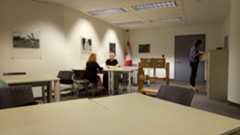 A colour photograph of a room with large tables for the purpose of consulting documents.