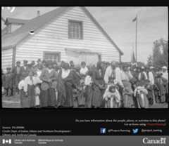 Large group of people standing in front of a building.