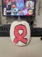 Students painted pumpkins with various designs including the symbol for breast cancer awareness.