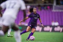 Image of Viviana Villacorta playing the ball out of the midfield.