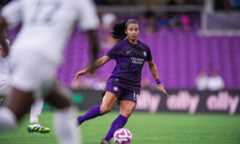 Image of Viviana Villacorta playing the ball out of the midfield.