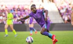 Image of Grace Chanda dribbling the ball.