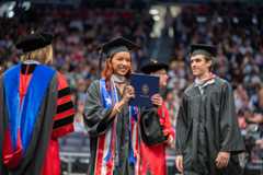 Photo of student at graduation