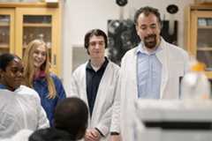 Faculty and students in a lab