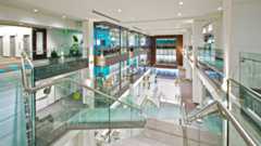 Interior of US Bancorp Tower with modern glass and wood finishes.