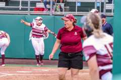 Texas State head coach Ricci Woodard cheers for her players as they spring around the bases and score over Texas A&amp;M, Tuesday, April 6, 2021, at Bobcat Softball Complex. The Bobcats beat the Aggies 7-6.