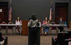 Student Government Senator Emma Vega reads the legislation regarding Jayden de Laura, Monday, Jan. 29, 2024, at the LBJ Teaching Theater. 