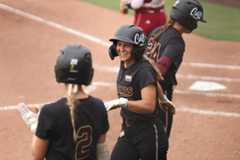Texas State senior outfielder Ciara Trahan (6) smiling and returning to the dugout after scoring against Troy, Friday, April 18th, 2025 at Bobcat Softball Stadium.