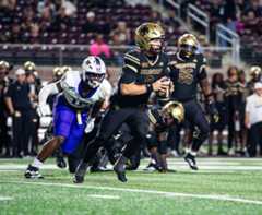 Freshman quarterback Brad Jackson (8) scrambles in the pocket against James Madison, Tuesday, Oct. 28, 2025, at UFCU Stadium. Texas State lost 52-20