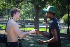 Texas State alumnus Rodrick Hockley (right) sells his grandmother’s homemade sweet-and-spicy pickles for his business Pickley Pickles, Friday, Sept. 26, 2025, at Sewell Park.